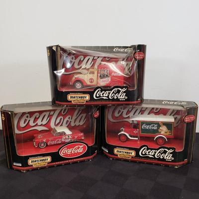 LOT 146: Coca Cola Collectibles-Matchbox New in Package & Toy Truck with Conveyor Belt & Mini Coke Bottles