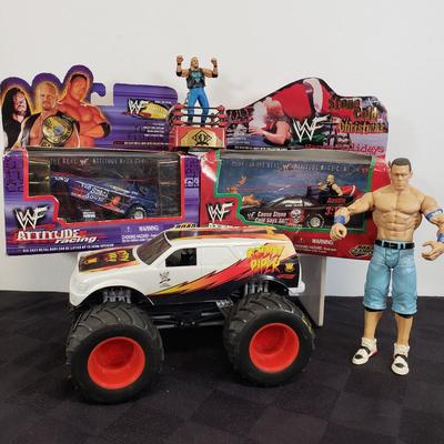LOT 147: Vintage WWF Road Champs Cars, Roddy Piper Monster Truck, WCW Diamond Dallas Page Keychain & John Cena Action Figure