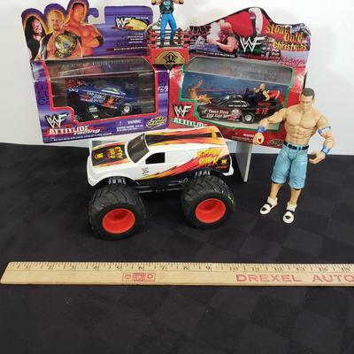 LOT 147: Vintage WWF Road Champs Cars, Roddy Piper Monster Truck, WCW Diamond Dallas Page Keychain & John Cena Action Figure