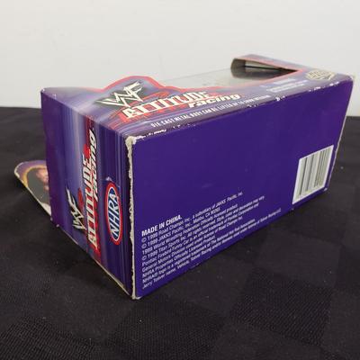 LOT 147: Vintage WWF Road Champs Cars, Roddy Piper Monster Truck, WCW Diamond Dallas Page Keychain & John Cena Action Figure