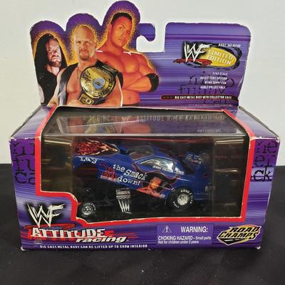 LOT 147: Vintage WWF Road Champs Cars, Roddy Piper Monster Truck, WCW Diamond Dallas Page Keychain & John Cena Action Figure