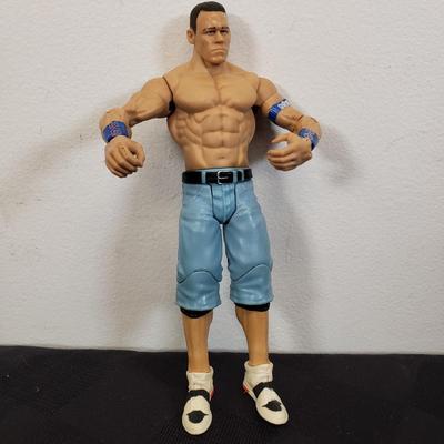 LOT 147: Vintage WWF Road Champs Cars, Roddy Piper Monster Truck, WCW Diamond Dallas Page Keychain & John Cena Action Figure