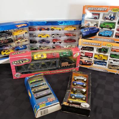 LOT 150: New in Package Assortment of Hot Wheels, Matchbox & More