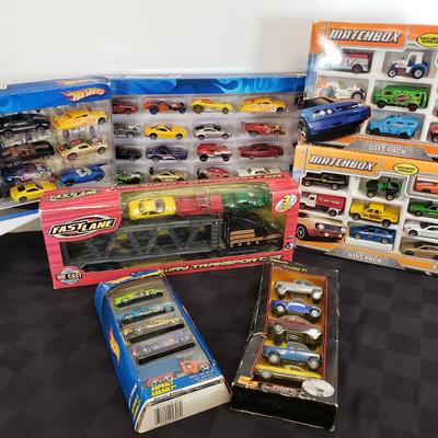 LOT 150: New in Package Assortment of Hot Wheels, Matchbox & More