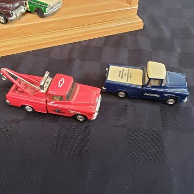 LOT 151: Princeton Gallery Popular Company Branded Trucks on Display Shelf