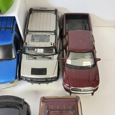 LOT 212: Die Cast Family Vehicles & More