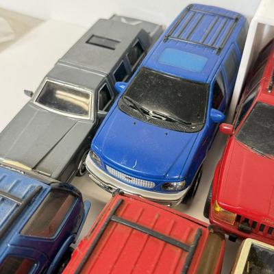 LOT 212: Die Cast Family Vehicles & More
