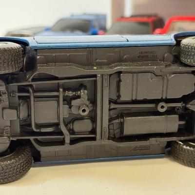LOT 212: Die Cast Family Vehicles & More