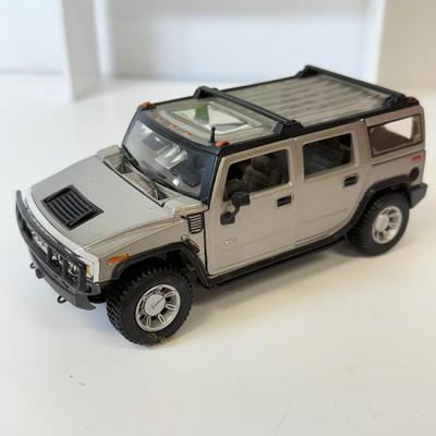 LOT 212: Die Cast Family Vehicles & More