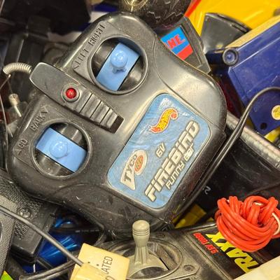 LOT 216: 40 Gallon Tub of Radio Control RC Cars & Remotes