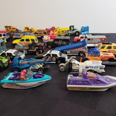 LOT 222: Assortment of Specialty Cars & Trucks with Boats-Matchbox, Hot Wheels & More