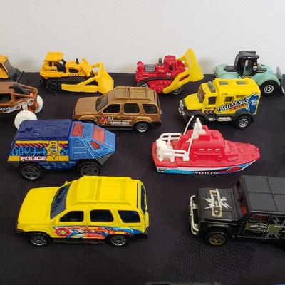 LOT 222: Assortment of Specialty Cars & Trucks with Boats-Matchbox, Hot Wheels & More