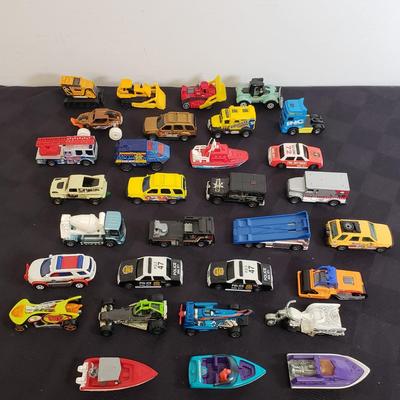LOT 222: Assortment of Specialty Cars & Trucks with Boats-Matchbox, Hot Wheels & More