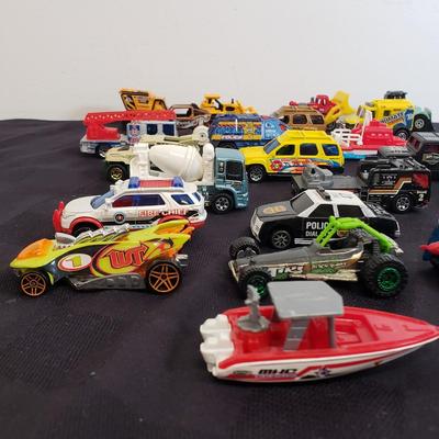 LOT 222: Assortment of Specialty Cars & Trucks with Boats-Matchbox, Hot Wheels & More