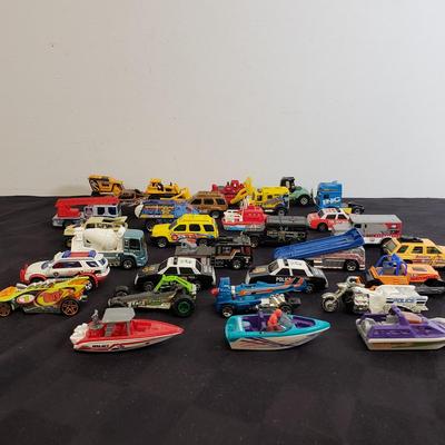 LOT 222: Assortment of Specialty Cars & Trucks with Boats-Matchbox, Hot Wheels & More