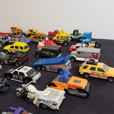 LOT 222: Assortment of Specialty Cars & Trucks with Boats-Matchbox, Hot Wheels & More