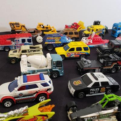 LOT 222: Assortment of Specialty Cars & Trucks with Boats-Matchbox, Hot Wheels & More