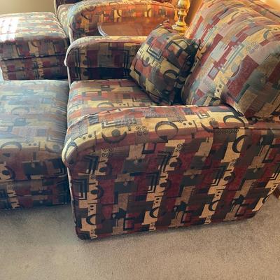 2 decorative chairs and ottomans
