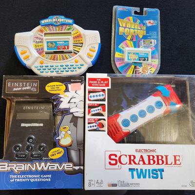 Sale Photo Thumbnail #72: New & Vintage Electronic / Handheld Games Wheel of Fortune, Scrabble & Brainwave.

Will receive all items pictured as is.