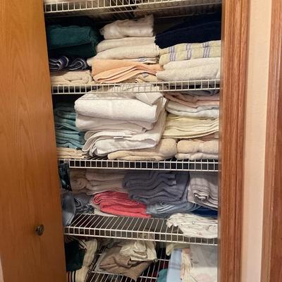 Closet full of towels and some sheets