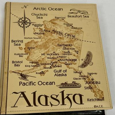 Sale Photo Thumbnail #174: Synthetic Tan Leather cover with a map of Alaska with many points of interest identified.  Approx. size 8.5' X 10". Holds 208 4' x 6" prints. Great for holding Alaska cruise or other Alaska vacation photos.  Like new condition.