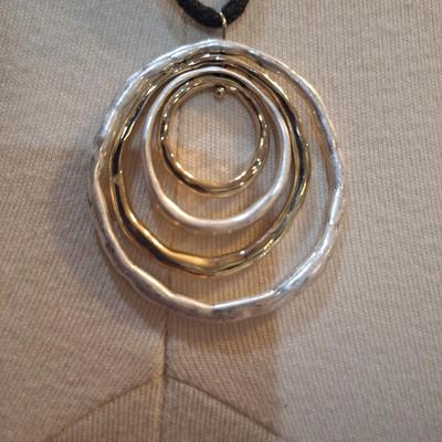 Sale Photo Thumbnail #423: Necklace with pendant of large rings