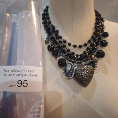 Sale Photo Thumbnail #424: Black charm necklace- hearts, cameo and other charms.