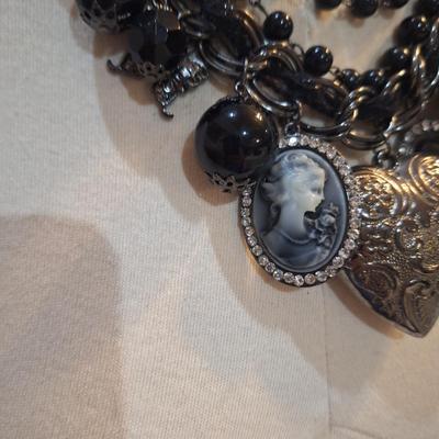 Sale Photo Thumbnail #427: Black charm necklace- hearts, cameo and other charms.