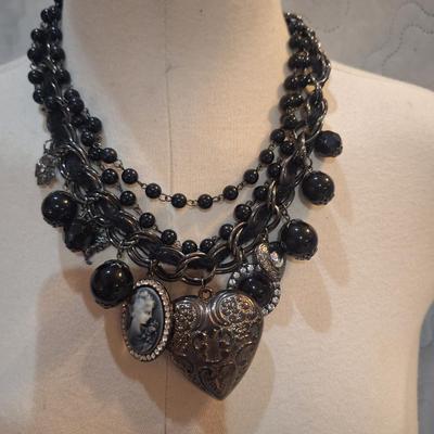 Sale Photo Thumbnail #425: Black charm necklace- hearts, cameo and other charms.