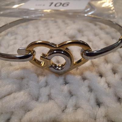Sale Photo Thumbnail #470: Gold and silver toned bracelet with heart
