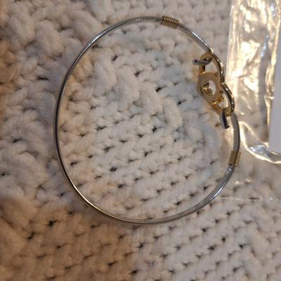 Sale Photo Thumbnail #474: Gold and silver toned bracelet with heart