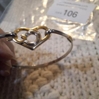 Sale Photo Thumbnail #472: Gold and silver toned bracelet with heart