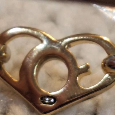 Sale Photo Thumbnail #473: Gold and silver toned bracelet with heart