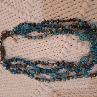 Sale Photo Thumbnail #518: Multi strand rock chip necklace with turquoise color rocks and silver tone beads