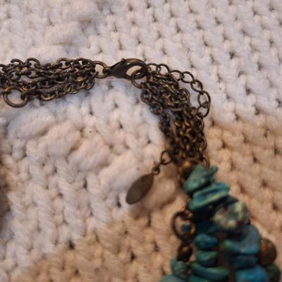 Sale Photo Thumbnail #519: Multi strand rock chip necklace with turquoise color rocks and silver tone beads