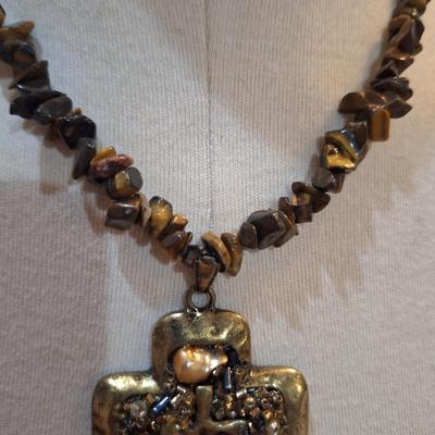 Sale Photo Thumbnail #569: Rock chip necklace wit brass colored stone pendant