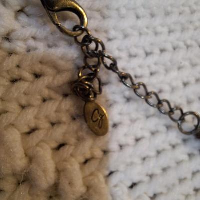 Sale Photo Thumbnail #570: Rock chip necklace wit brass colored stone pendant