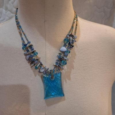 Sale Photo Thumbnail #599: Rock chip necklace with large rectangular blue pendant