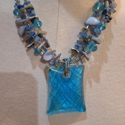 Sale Photo Thumbnail #601: Rock chip necklace with large rectangular blue pendant