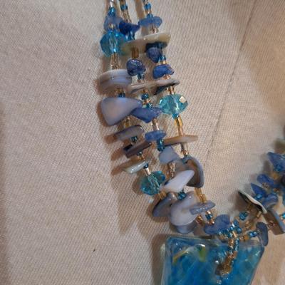 Sale Photo Thumbnail #602: Rock chip necklace with large rectangular blue pendant
