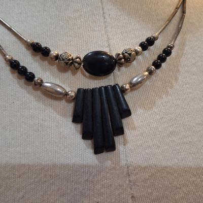 Sale Photo Thumbnail #610: Silver tone and black choker necklace with geometric pendant