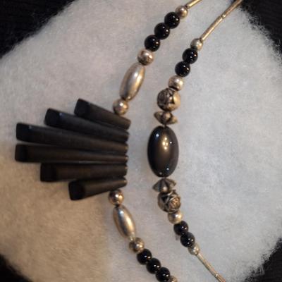 Sale Photo Thumbnail #612: Silver tone and black choker necklace with geometric pendant