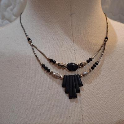 Sale Photo Thumbnail #609: Silver tone and black choker necklace with geometric pendant