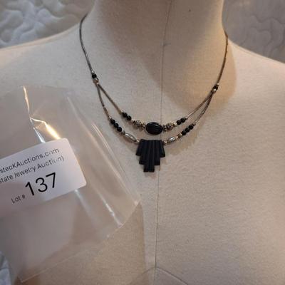 Sale Photo Thumbnail #613: Silver tone and black choker necklace with geometric pendant