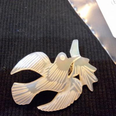Sale Photo Thumbnail #641: carved mother of pearl swallow brooch