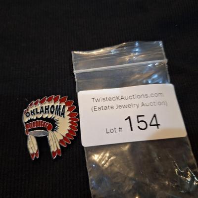 Sale Photo Thumbnail #686: lapel pin of chief headdress labeled Oklahoma