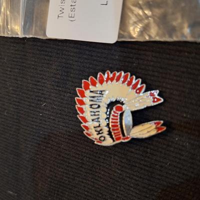 Sale Photo Thumbnail #687: lapel pin of chief headdress labeled Oklahoma