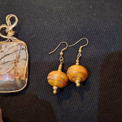 Sale Photo Thumbnail #710: Wired rock pendant and similar colored earrings.