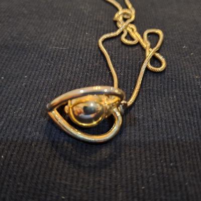 Sale Photo Thumbnail #718: long gold tone necklace with pendant