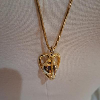 Sale Photo Thumbnail #717: long gold tone necklace with pendant